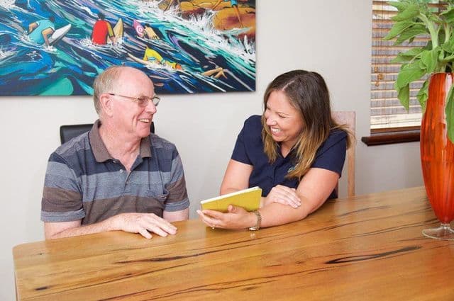 Elderly man and daughter at home