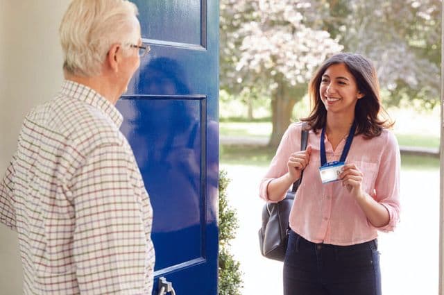Home care assessor entering a clients home