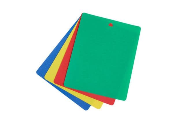 Four differently coloured cutting boards