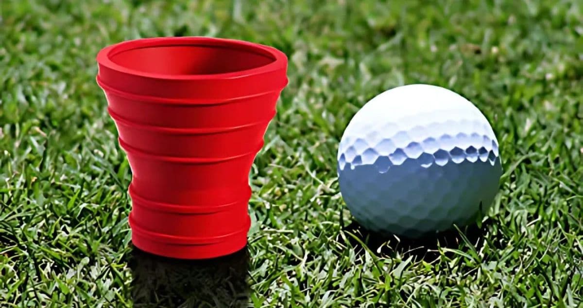 A red suction cup used to pick up golf balls