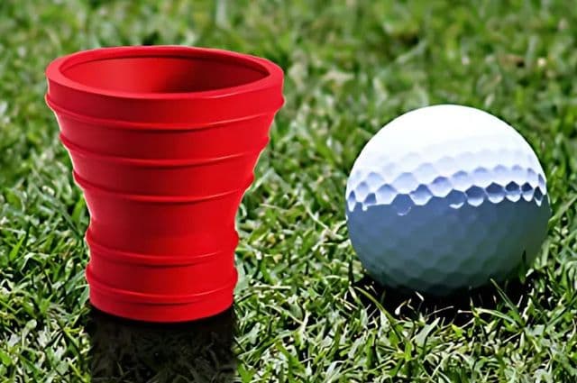 A red suction cup used to pick up golf balls