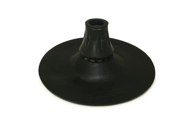 A black circular piece of rubber to stick on the bottom of walking sticks