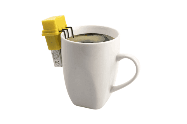 A yellow battery-operated liquid level finder attached to the rim of a cup