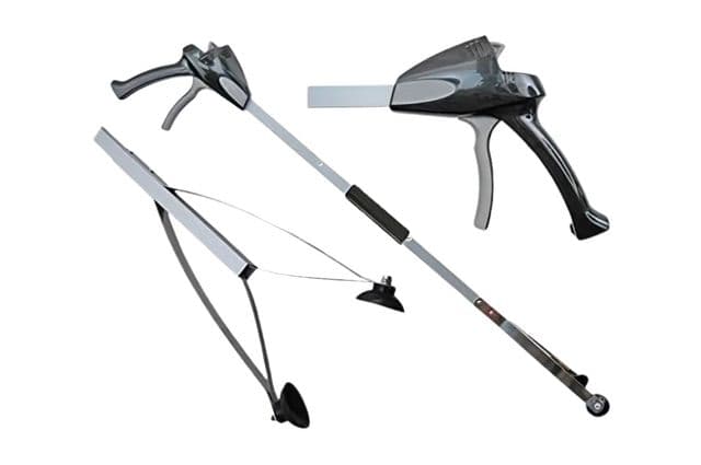 A long-handled reaching device with suction cups on the grabber
