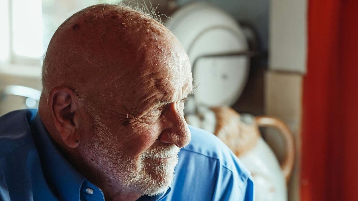 Older man staring into the middle distance