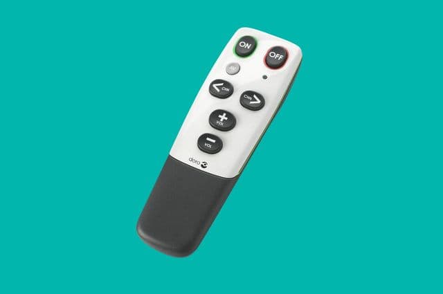 A white TV remote with big black buttons
