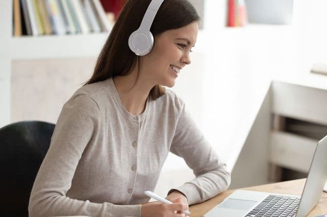 Support worker doing e-Learning on her laptop