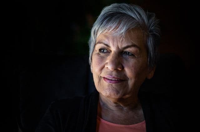 Thoughtful older lady taking part in the discussion paper