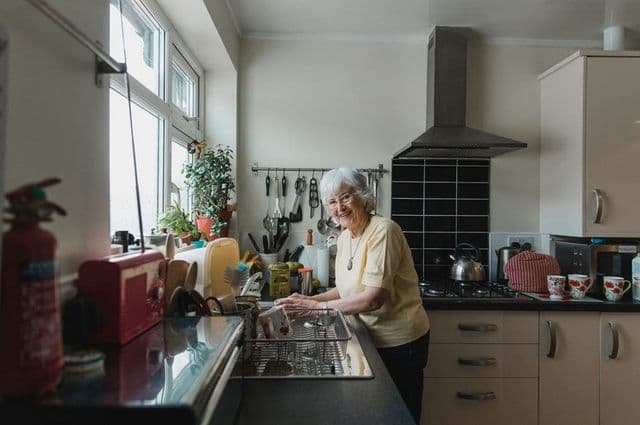 Elderly lady washing-up