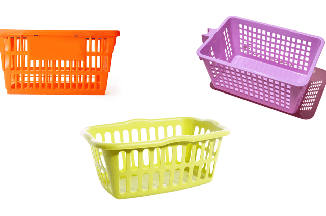 A pink basket, a purple basket, and a green basket