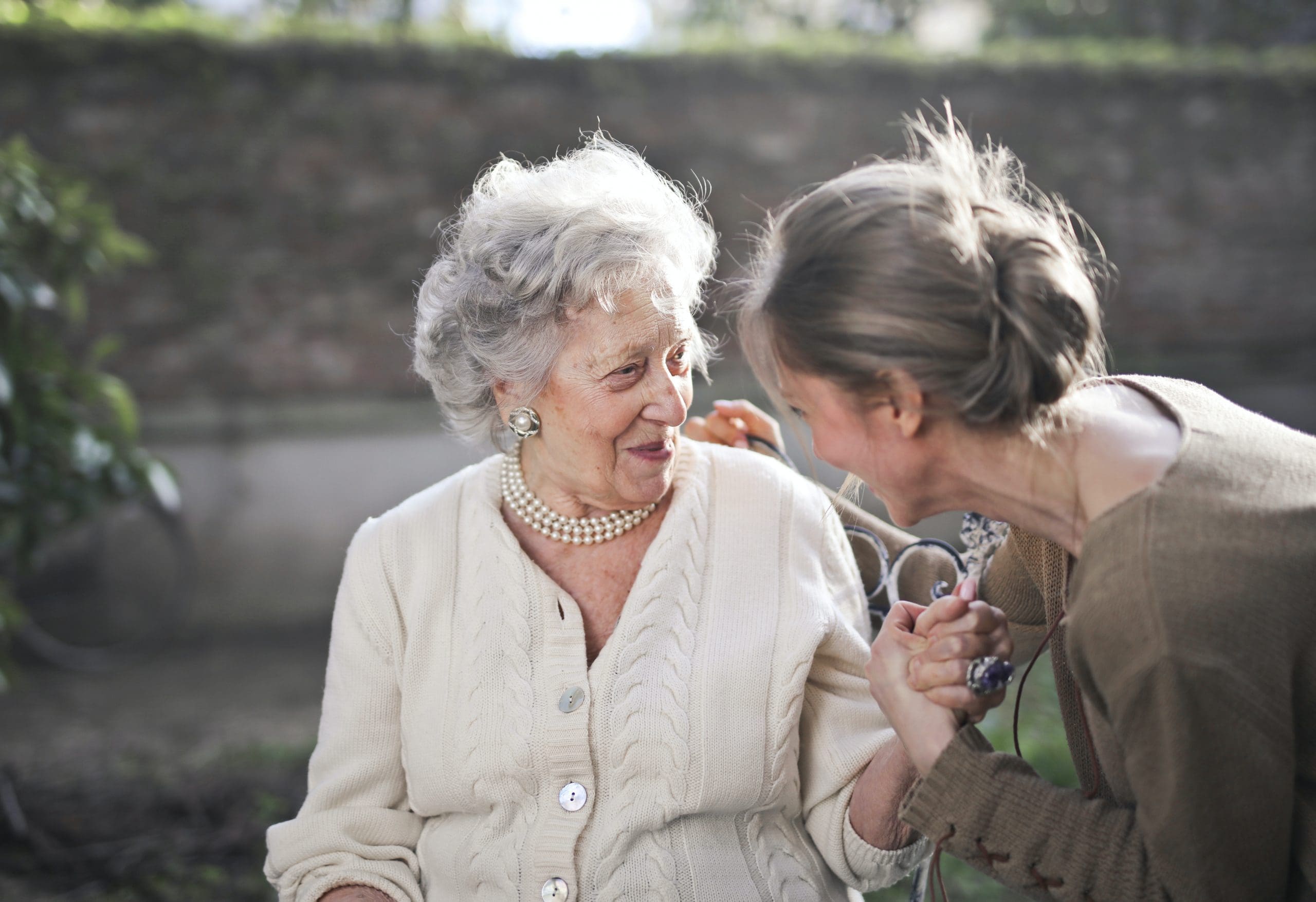 Elderly lady with her carer