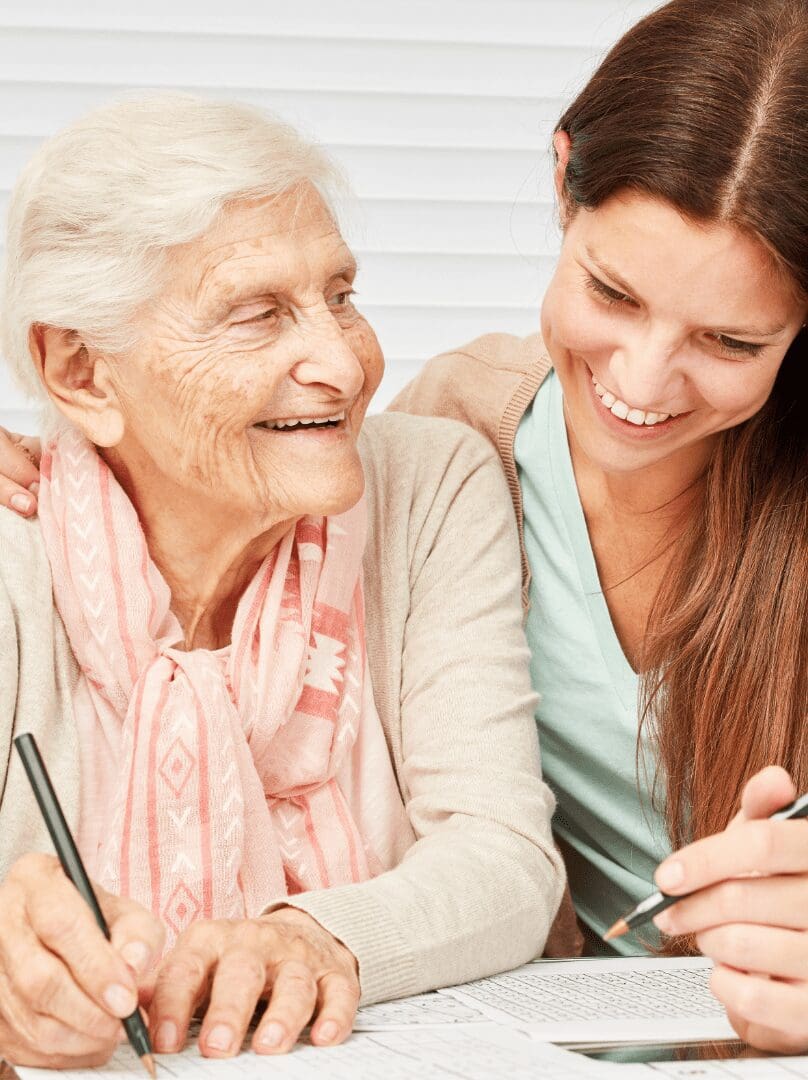 Support worker and client reviewing support plan