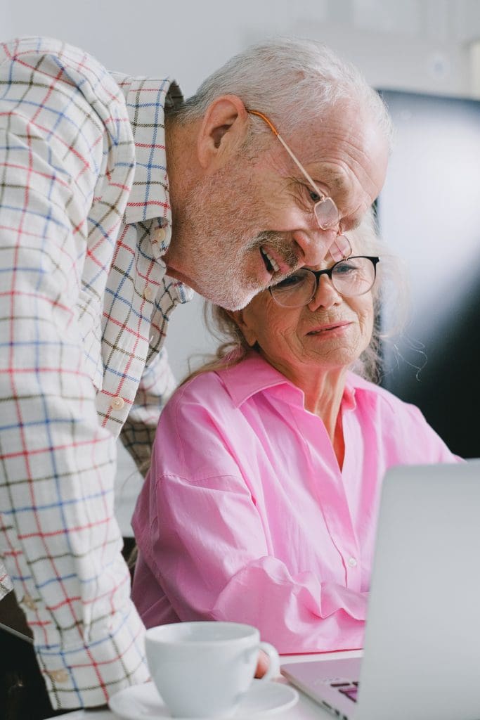 Older couple reviewing evidence-base content of wellness and reablement