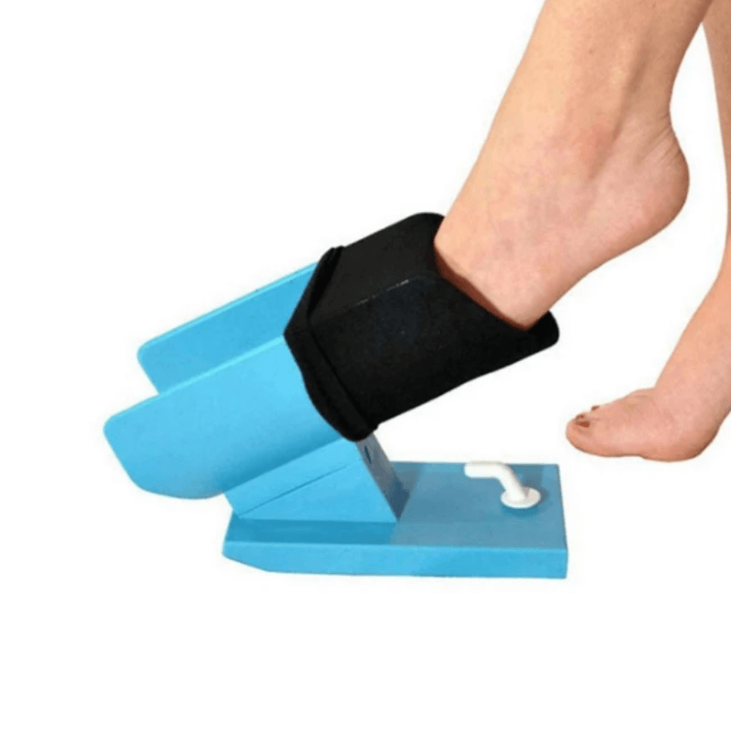 A standing sock aid that sits on the ground and helps slip socks on without too much bending