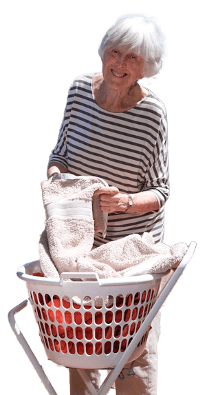 Elderly lady hanging washing with assistive technology help
